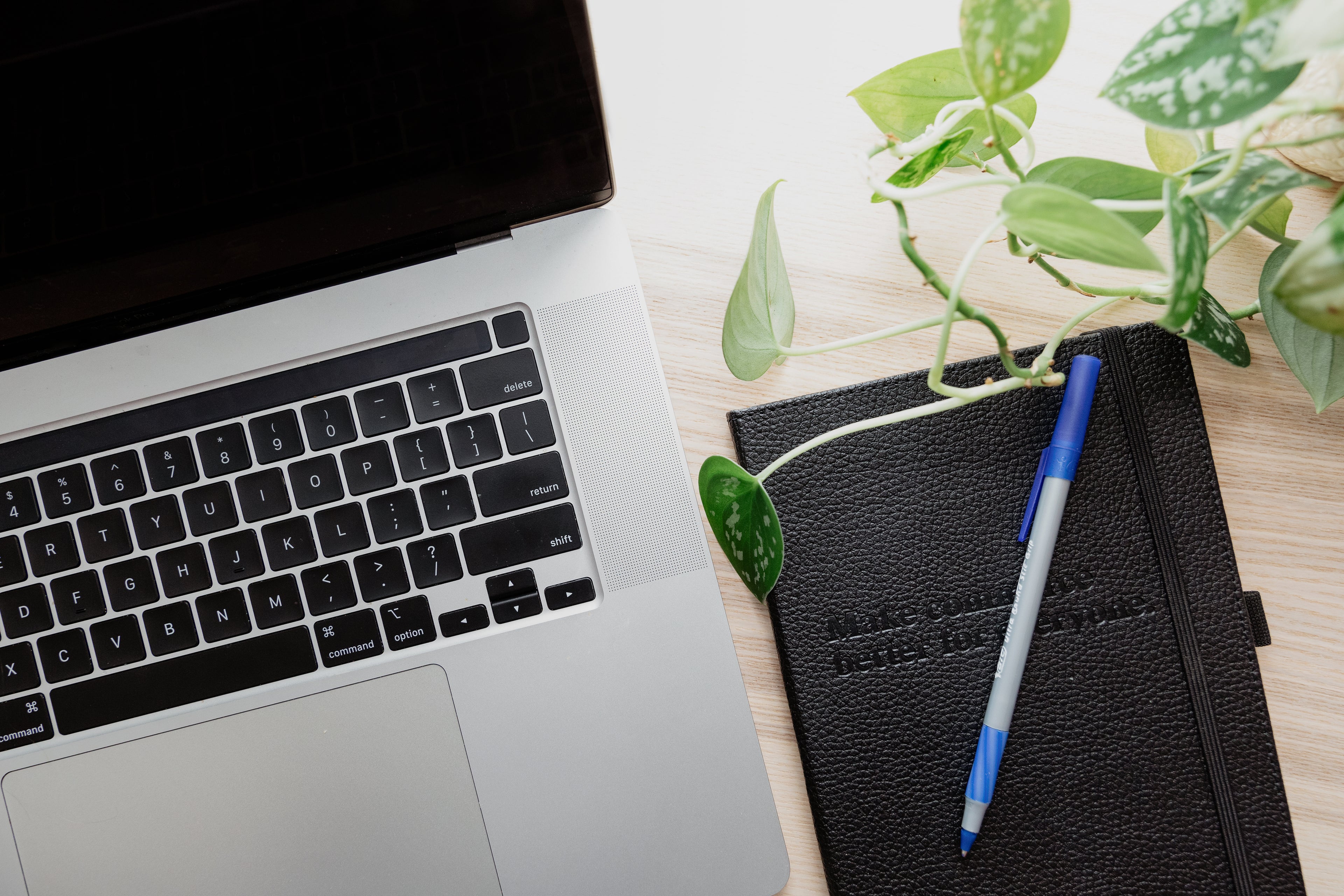 Notebook, laptop, pen for project planning